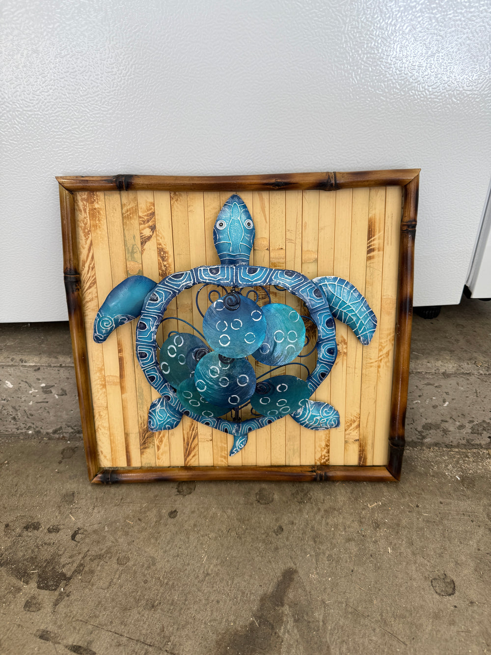Metal turtle with bamboo frame